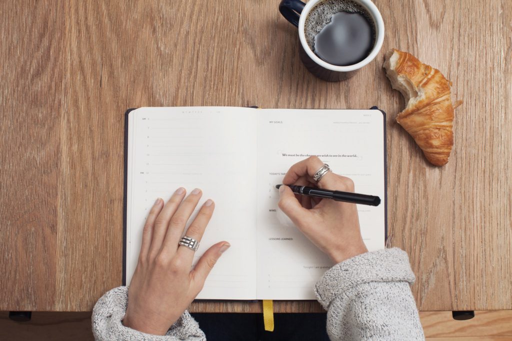 writing in dairy planner for  better work life 